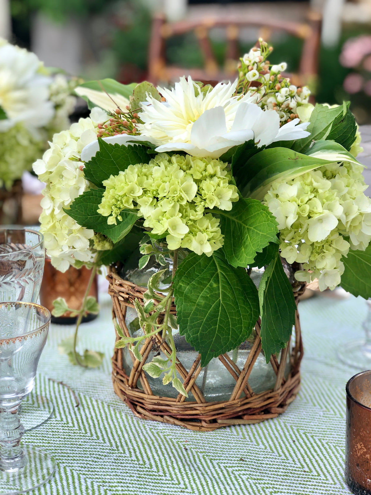 Wicker basket vase and hurricane with natural woven texture