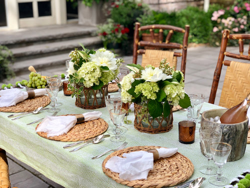 Wicker basket hurricane styled as a natural table centerpiece