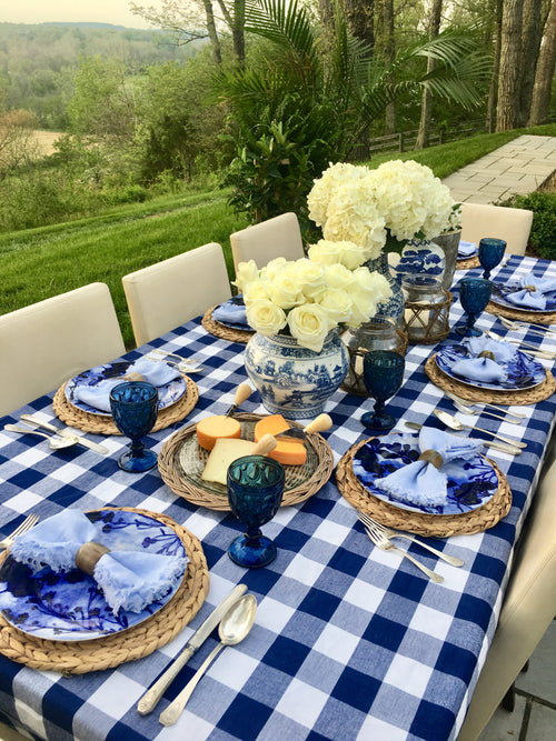 Layered blue-and-white place settings with vases from the You Blue Me Away tablescape kit